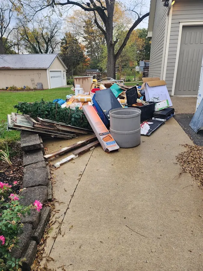 Dumpster being loaded with debris for Roofing Dumpster Rental in Hondo
